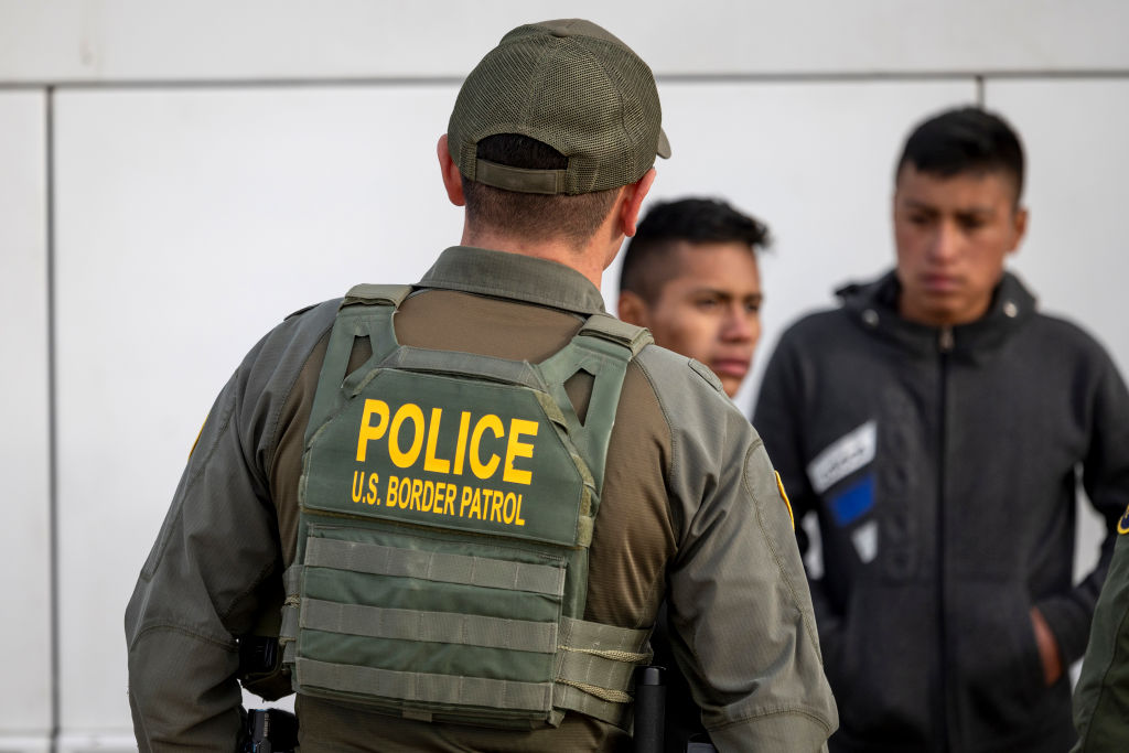 Immigrants prepare to board a bus in Texas earlier this year after crossing the US-Mexico border. Credit: Getty