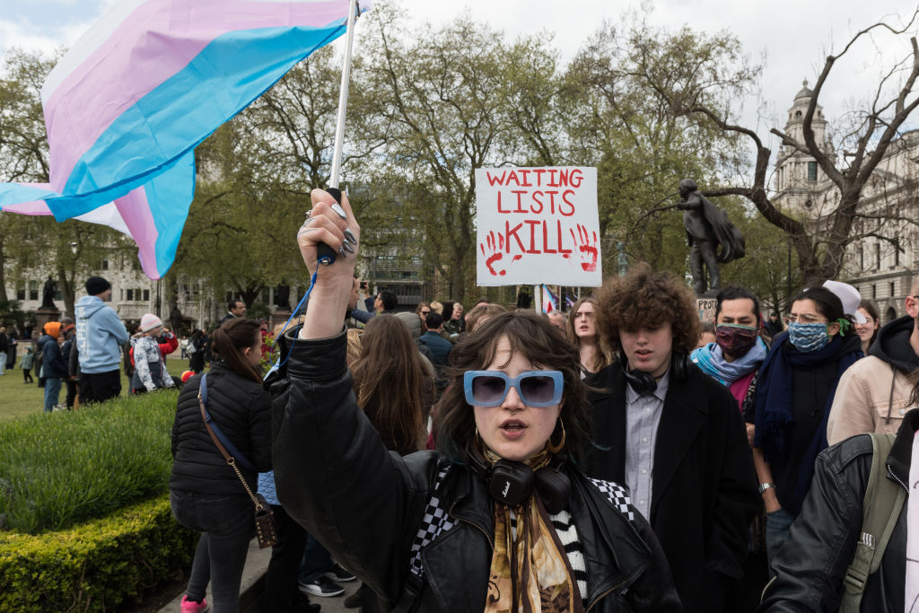 Activists protest against the puberty-blocker ban in London earlier this year. Credit: Getty