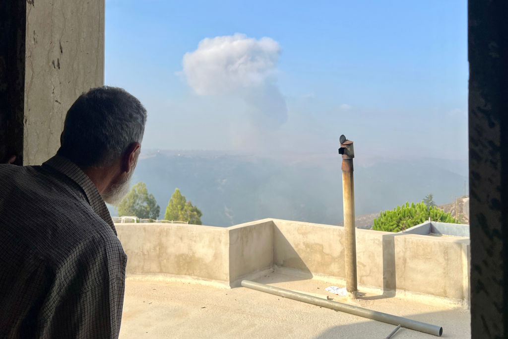 A man looks on after an Israeli airstrike in the southern Lebanese village of Qsair on Sunday. Credit: Getty