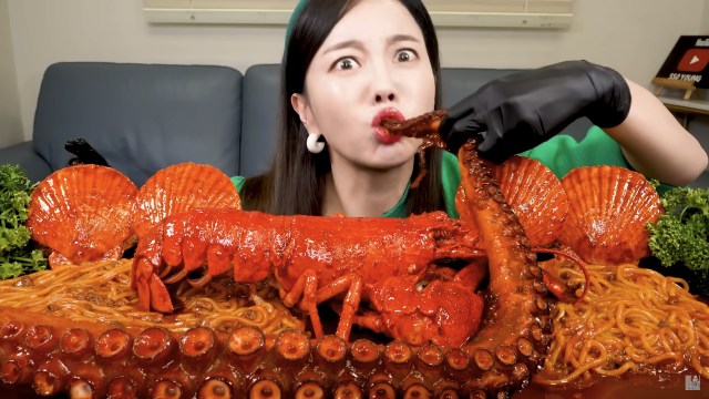 How far will someone push themselves to be big in the mukbang community? 
(Credit: YouTube)