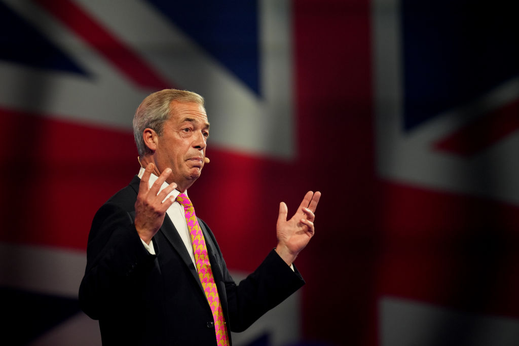 Nigel Farage addresses the Reform Party 2024 Conference in Birmingham today. Credit: Getty