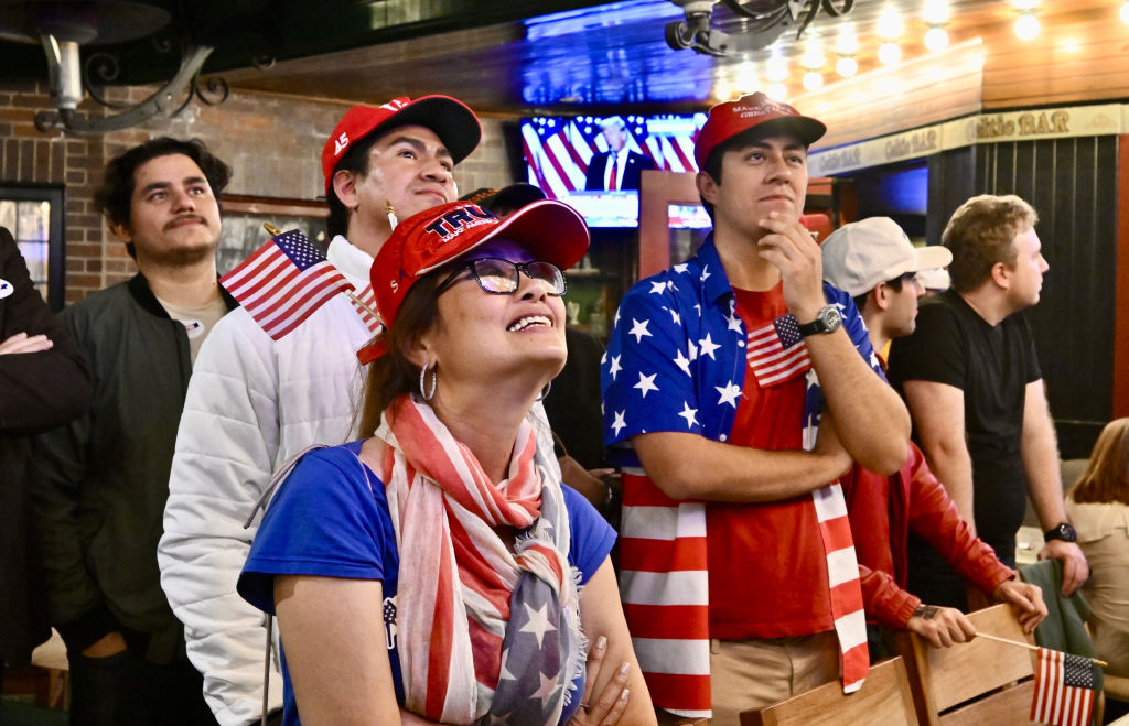 Republicans in Newport Beach, California watch Trump give his victory speech earlier this week. Credit: Getty
