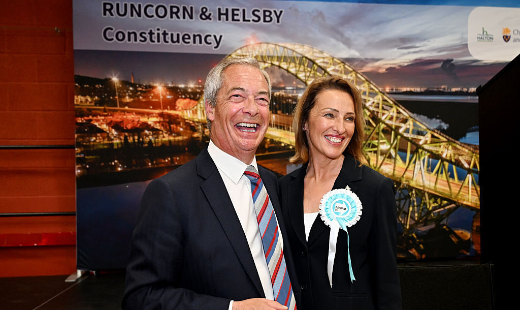 Nigel Farage and Reform candidate Sarah Pochin celebrate after her victory in Runcorn and Helsby. Credit: Getty