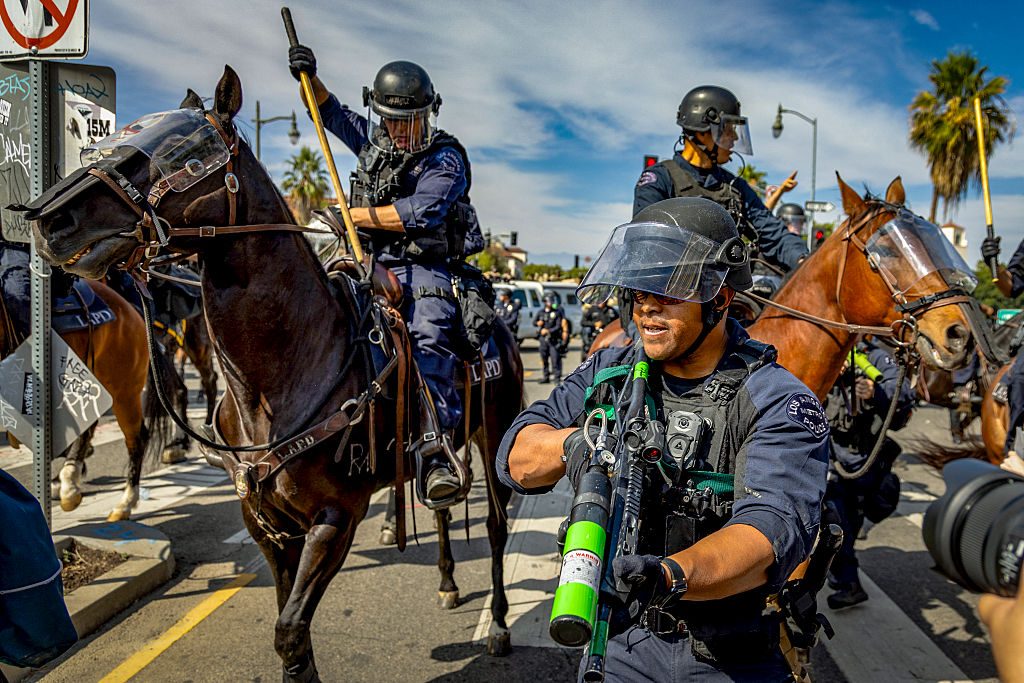 LAPD officers attempt to control crowds during a protest in California last week. Credit: Getty