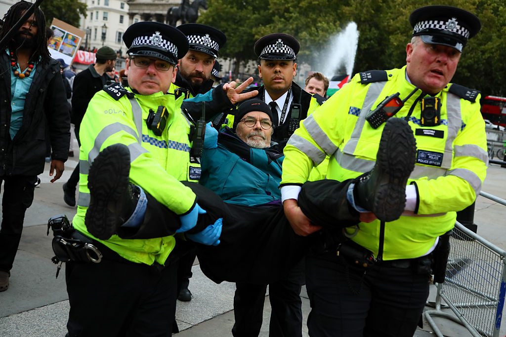 A Palestine Action supporter is carried away by police in central London yesterday. Credit: Getty
