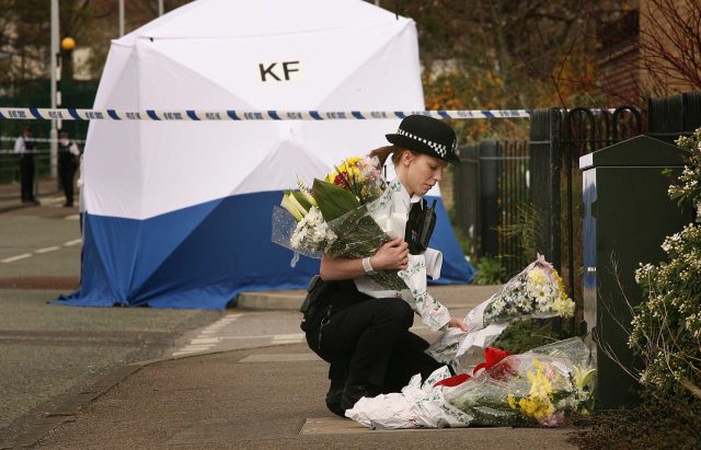 Floral tributes in north-east London after the stabbing of a 14-year-old boy. Photo: Peter Macdiarmid/ Getty Images. 