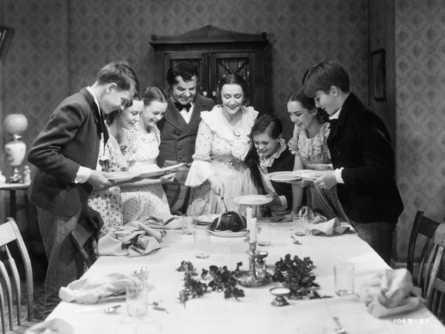 The Cratchit family at Christmas dinner, in the 1938 movie. Credit: Getty