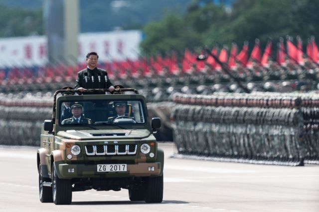 Xi Jinping inspecting the troops. Credit: Getty.