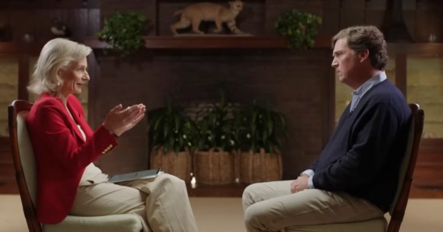 Tucker Carlson speaks to Zanny Minton Beddoes. Credit: The Economist/X