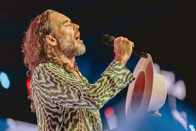 Russell Brand at Turning Point's 2025 AmericaFest conference.(Olivier Touron /AFP/ Getty Images)