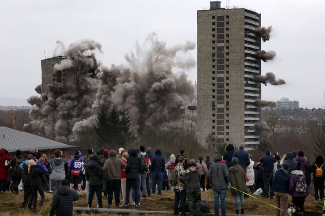 Spectators watch a demolition in Glasgow in 2025. (Jeff J Mitchell/Getty Images)