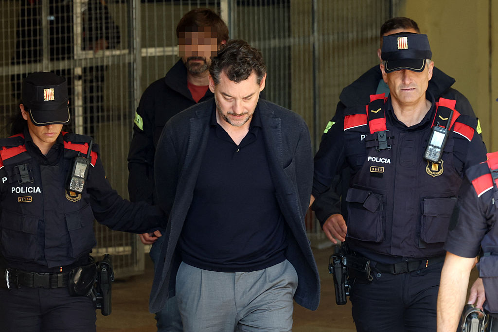 Jonathan Andic, the son of Mango founder Isak Andic, is escorted by police following his arrest earlier this year. Credit: Getty